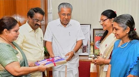 Justice Hema, then Culture Minister AK Balan handing over the Hema Commission Report to Chief Minister Pinarayi Vijayan