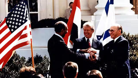 Anwar El Sadat, Jimmy Carter and Menachem Begin at the White House to sign the 1979 Egypt–Israel peace treaty. 
