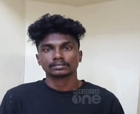 Image of Anoop wearing a black dress. 