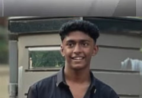 Image of Mohammed Shahabas wearing black shirt smiling in front of a metallic structure.