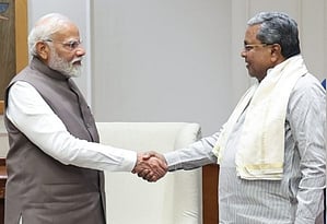 Karnataka Chief Minister Siddaramaiah and Prime Minister Narendra Modi