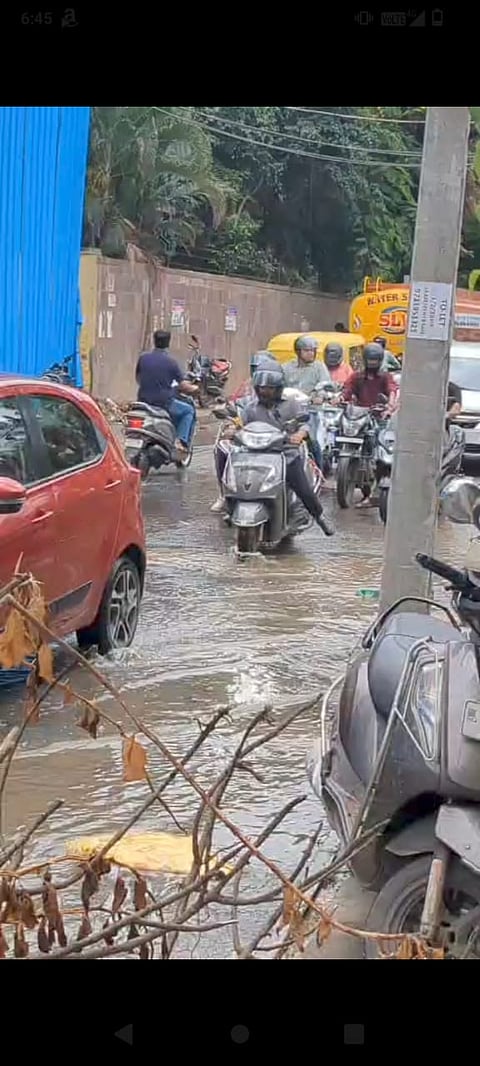 Motorists navigate a flooded stretch in Whitefield after heavy rains lashed Bengaluru.

