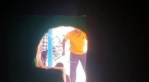 The video of the assault, which shows Ajith Kumar sitting on the floor being beaten with a stick while two other men looked on. 