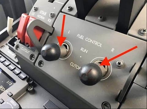 Shows two fuel control switches in an airplane's cockpit