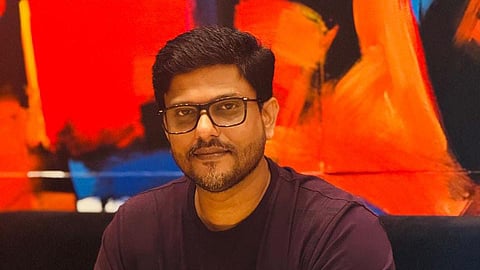 Image featuring Abhilash Mohan wearing a black t-shirt 