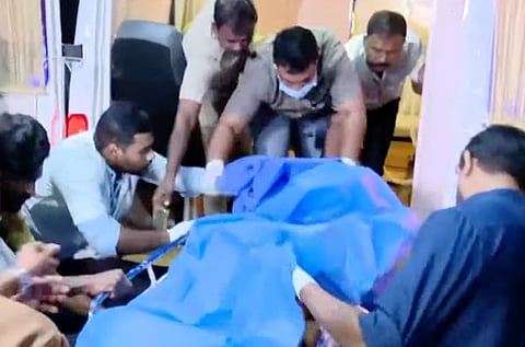 The victim being shifted to hospital