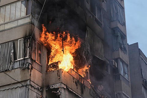 Smoke and flame rise from a residential building following an Israeli airstrike in central Beirut, Lebanon, Wednesday, March 18, 2026. 