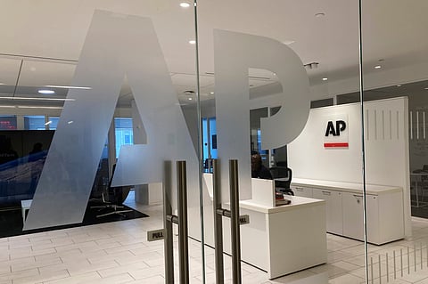 The Associated Press logo is shown at the entrance to the news organization's office in New York, July 13, 2023. 