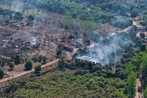 This photo released by Xinhua News Agency, this aerial drone photo taken May 5, 2026 shows rescuers working on site after an explosion at a fireworks plant in Guandu Town of Liuyang, central China's Hunan Province. 
