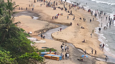 Water flows from a pond and along the way mingles with sewage and trickles into the beach at Varkala