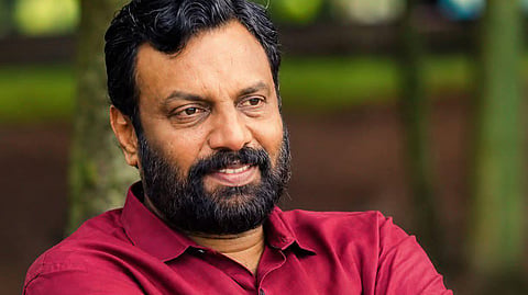 Image featirting P Sandosh Kumar wearing a red shirt 