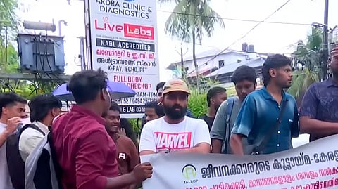 Employees protest outside Talrop’s head office after the company announced 300-plus layoffs