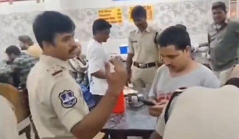 Hyderabad police checking phones of citizens at a cafe in Chaderghat