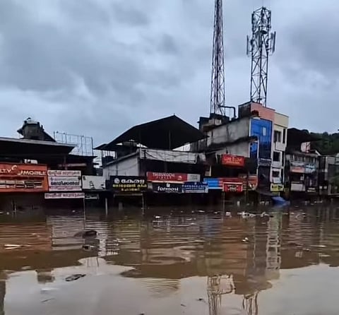 Flood waters submerge over half of the ground floor of a commercial building in Ittiyapara. 