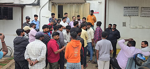 A group of gig workers gathering outside the office of Moonstone Ventures LLP in Telangana during a strike.