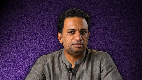 Image of Jijo John Puthezhathu in a grey Chinese collar shirt against a purple background