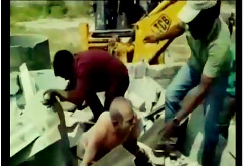 Watch: Officials bury 60-year-old man in a hurry to demolish house in Hyderabad