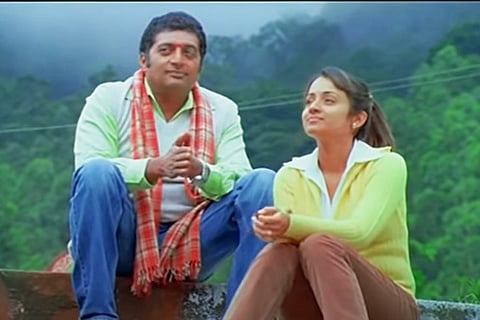 Actors Trisha and Prakash Raj in 'Abhiyum Naanum'