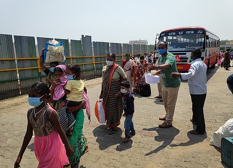 At Bengaluru’s bus stand, migrant workers have to pay exorbitant fares to get home