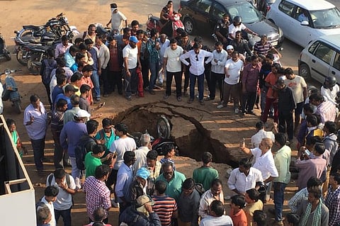 Hyderabad enraged as road caves in and swallows two bikes at Safilguda