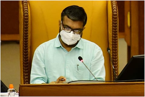 Kerala Speaker MB Rajesh, wearing mask and a light green shirt, on the speaker's chair in the Assembly 