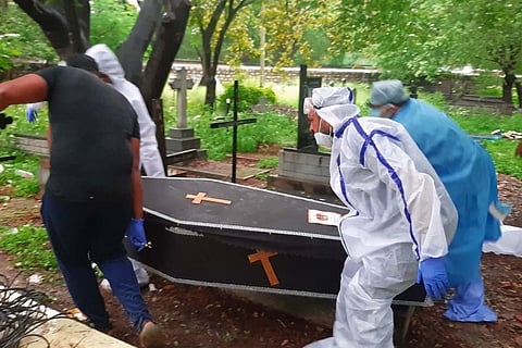Mercy Mission volunteers cremating a dead body