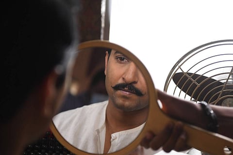 Nani looking at a mirror on the sets of Shyam Singha Roy