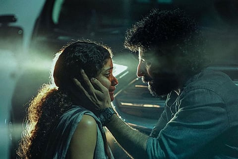 Anna Ben and Roshan Mathew in the first look poster of Night Drive