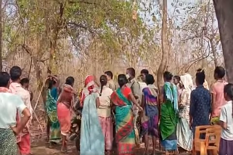 Adivasi women confront Forest field officers.