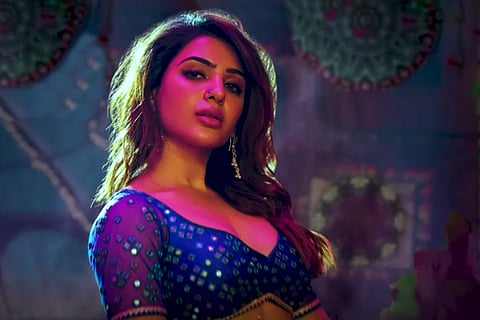Samantha in a blue dress under purple lighting in a still from the song Oo Antava