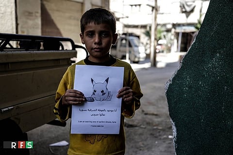 Syrian children are holding up Pokemon pictures, hoping someone will find and rescue them