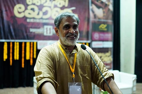 Venu Rajamony speaking into a mic