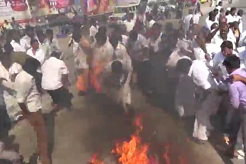 Video: AIADMK member’s veshti catches fire as they burn Vijayakanth’s effigy