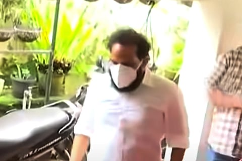 Bineesh Kodiyeri, son of CPI(M) leader Kodiyeri Balakrishnan in white attire and white mask, after being released from jail on bail. 