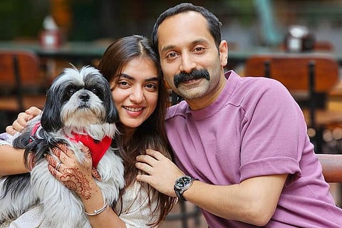 Nazriya and Fahadh with their pet dog Oreo