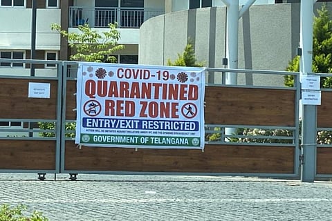 Banner outside gated community announcing containment zone in Telangana