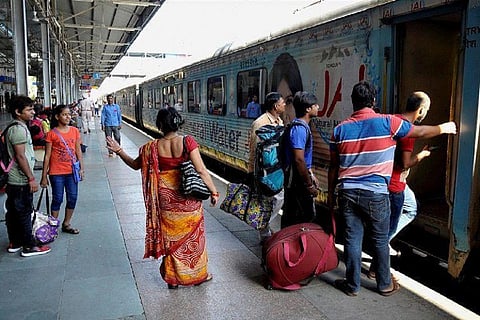 Passengers boarding on a train Indian Railways