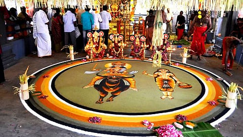 People worshipping at a Kuttichaathan temple in Thrissur's Peringottukara village