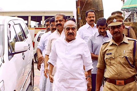 After holding on tight to his chair for a year, KM Mani finally goes