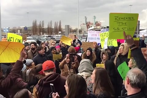 Protests erupt across US airports, but federal judge partially stays Trump’s Muslim ban