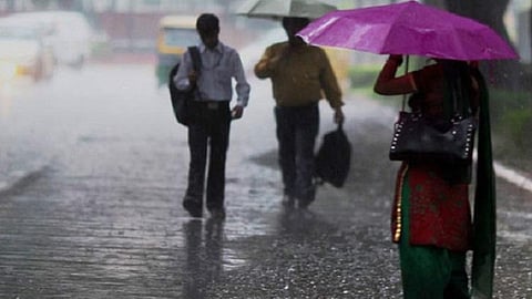 People standing in the rain