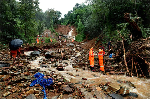 Rescue workers in a flooded area