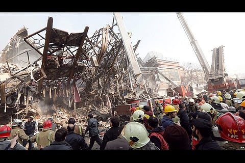 At least 30 fire fighters killed as Tehran's oldest trade tower collapses in blaze