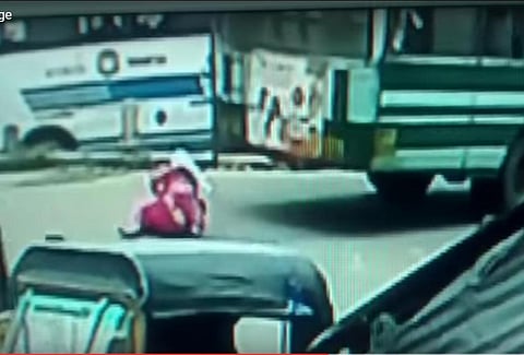 CCTV footage shows woman falling through moving bus as floor gives away