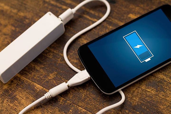 Portable charging used with a smartphone. (Photo: iStock)