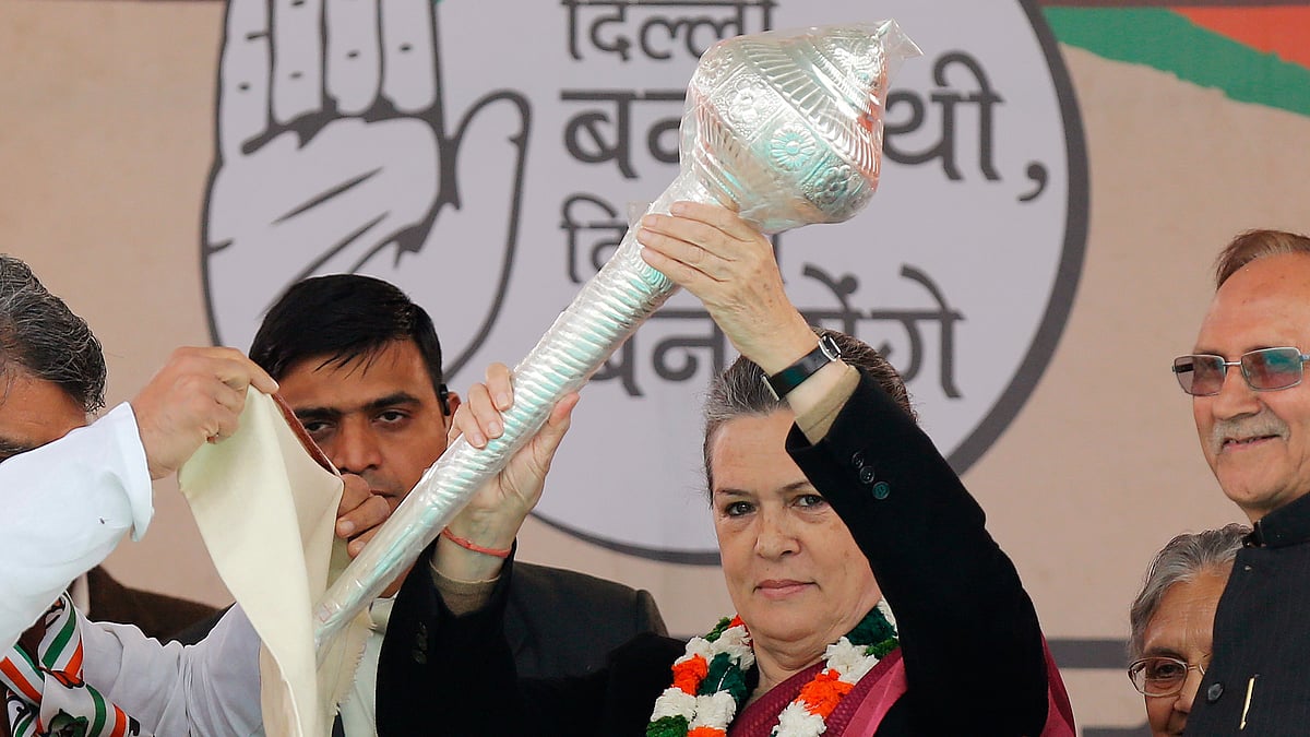 <!--EndFragment-->Congress President Sonia Gandhi holds a mace presented to her by her party workers during Delhi polls rally in February 2015. (Photo: Reuters)