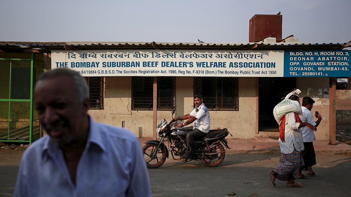 People walk past the beef dealers association office at an abattoir during a strike against a ban on the slaughter of bulls and bullocks in Mumbai March 23, 2015. (Photo: Reuters)