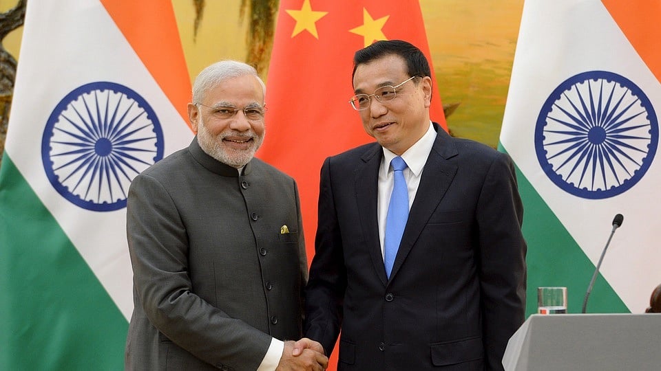 <!--StartFragment-->Indian Prime Minister Narendra Modi (L) shakes hands with Chinese Premier Li Keqiang during a news conference at the Great Hall of the People in Beijing, China. (Photo: Reuters)<!--EndFragment-->