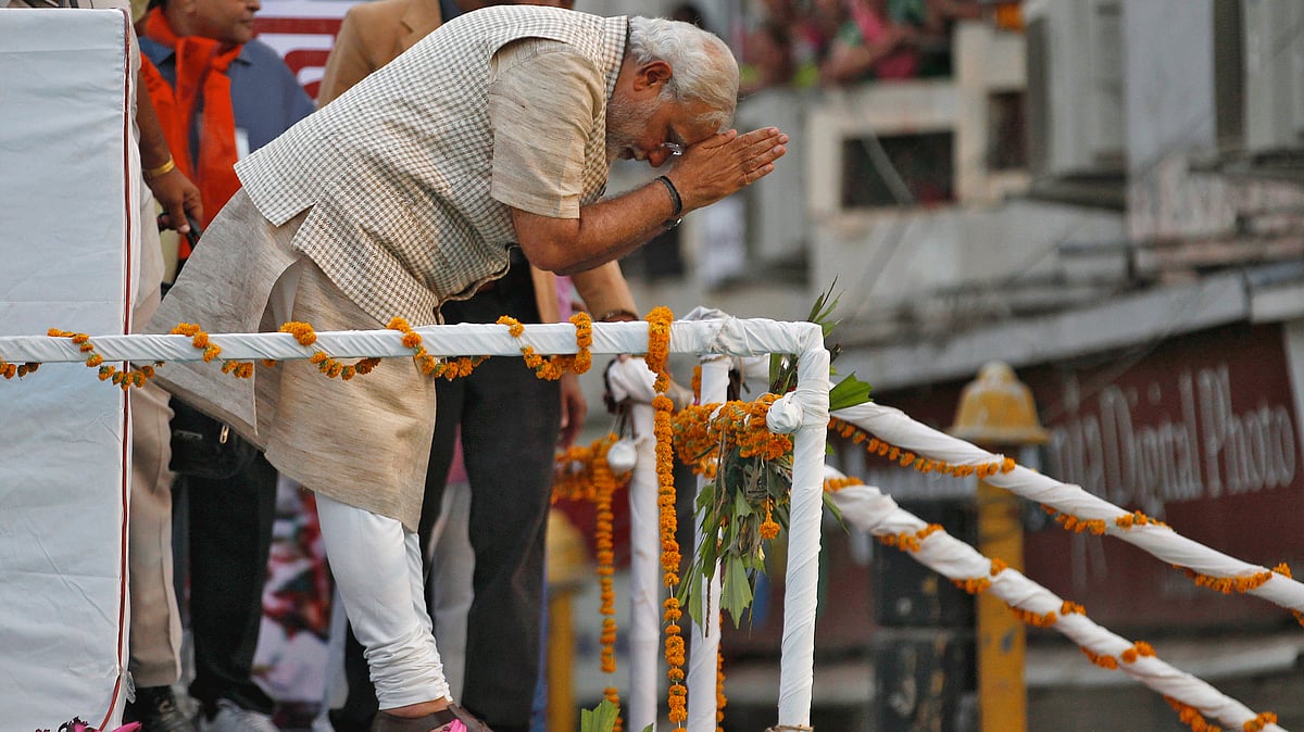 File picture:   Narendra Modi greets his supporters after addressing a public meeting in Vadodara on 16 May  2014 (Photo: Reuters)