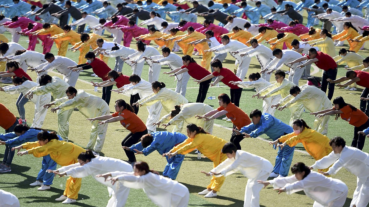 Participants performing Wuqinxi, a traditional Chinese fitness exercise, during a performance in Bozhou, China. (Photo: Reuters)